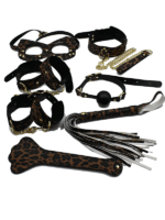 Leopard print BDSM 7-piece kit with restraints, mask, ball gag, leash, flogger, and paddle