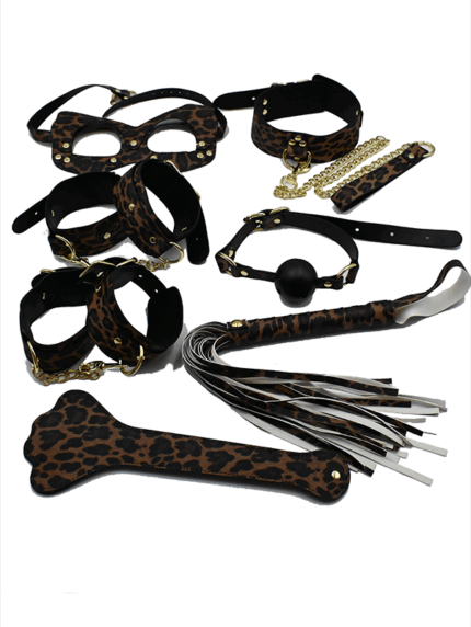Leopard print BDSM 7-piece kit with restraints, mask, ball gag, leash, flogger, and paddle