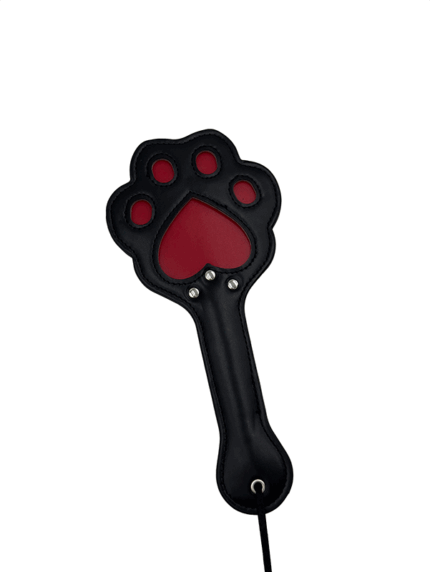 Black leather spanking paddle in the shape of a cat paw with red cutout detailing